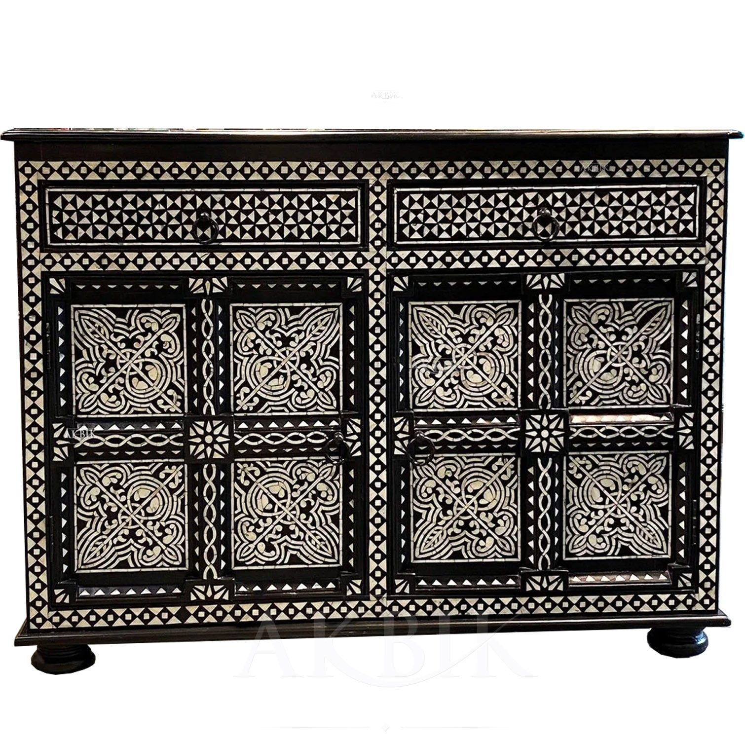An exquisite Levantine mother-of-pearl inlaid cabinet with a deep black ebony finish, featuring intricate patterns on the surface.