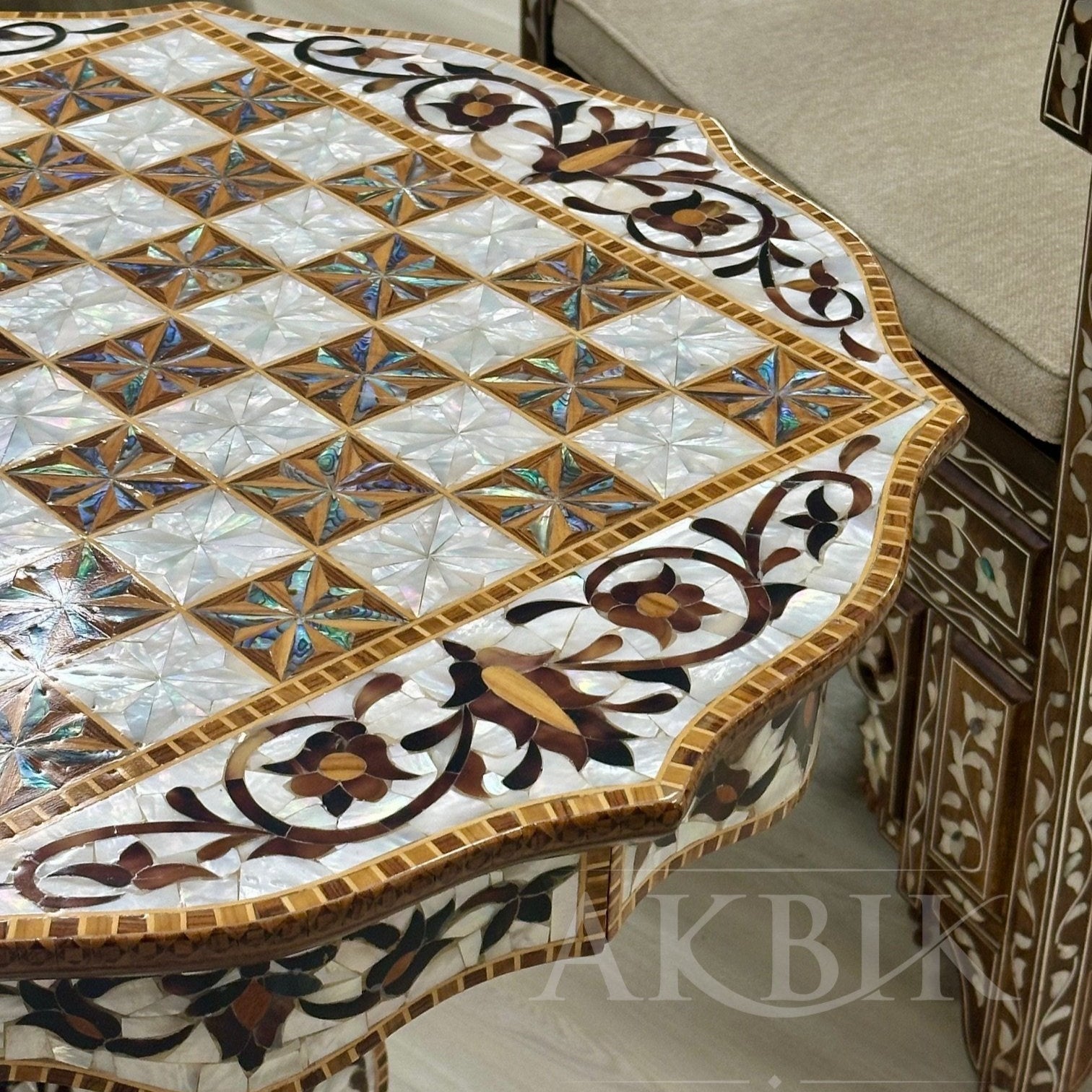 Decorative table with intricate mosaic design in a room setting