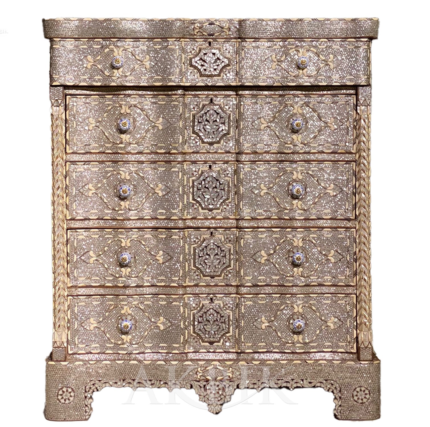 An ornate, antique-style bridal chest with mother-of-pearl detailing and multiple drawers.