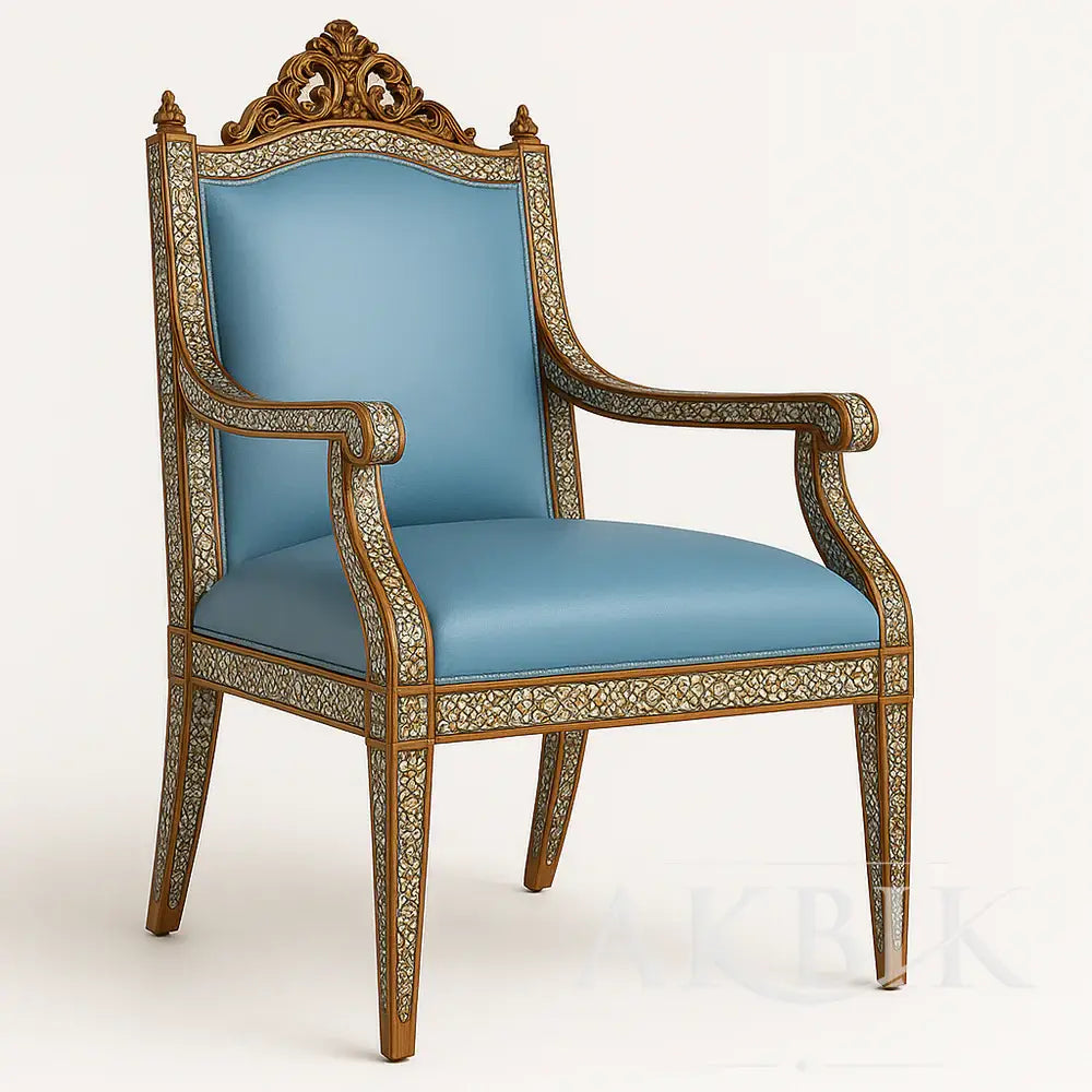 Ornate chair with blue cushion on a white background