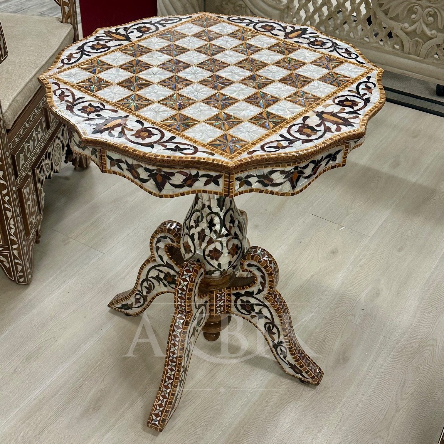 Decorative table with a checkered pattern on a light wooden floor.