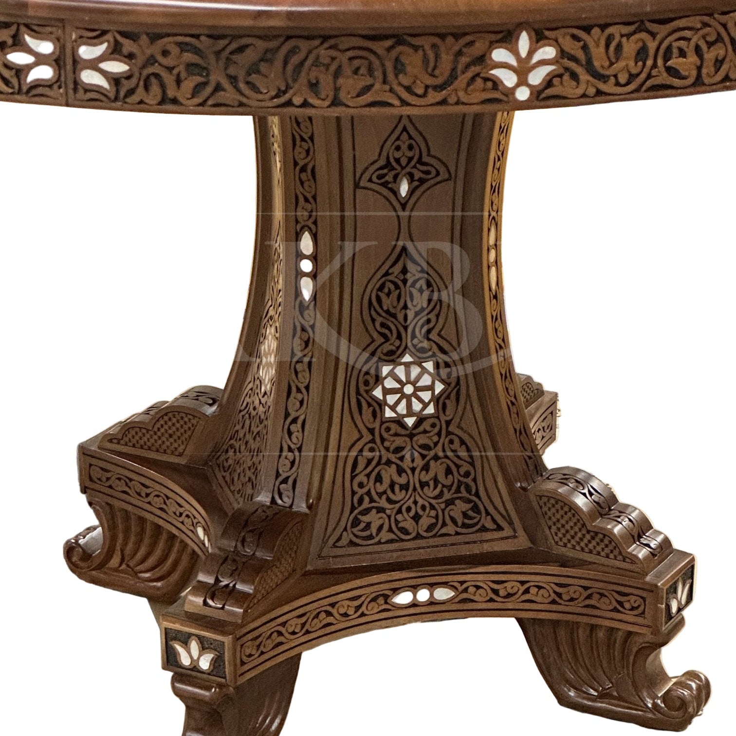 Decorative wooden table with intricate carvings on a cardboard surface
