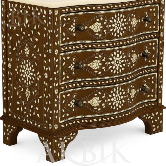 Decorative chest of drawers with intricate mother of pearl inlay 