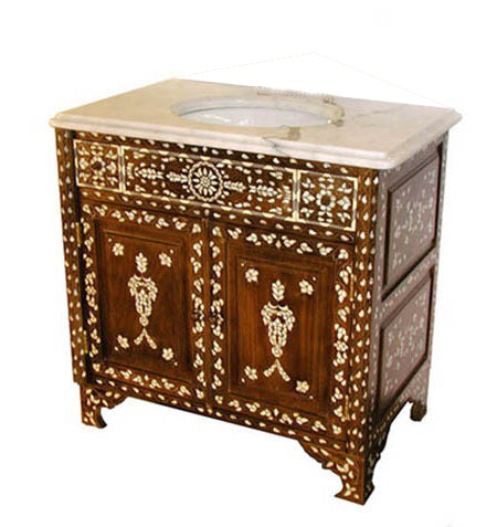 A handcrafted Syrian mother of pearl vanity with geometric and floral inlay patterns on the front and sides, constructed from solid walnut, featuring a marble countertop with a sink cutout in the center.