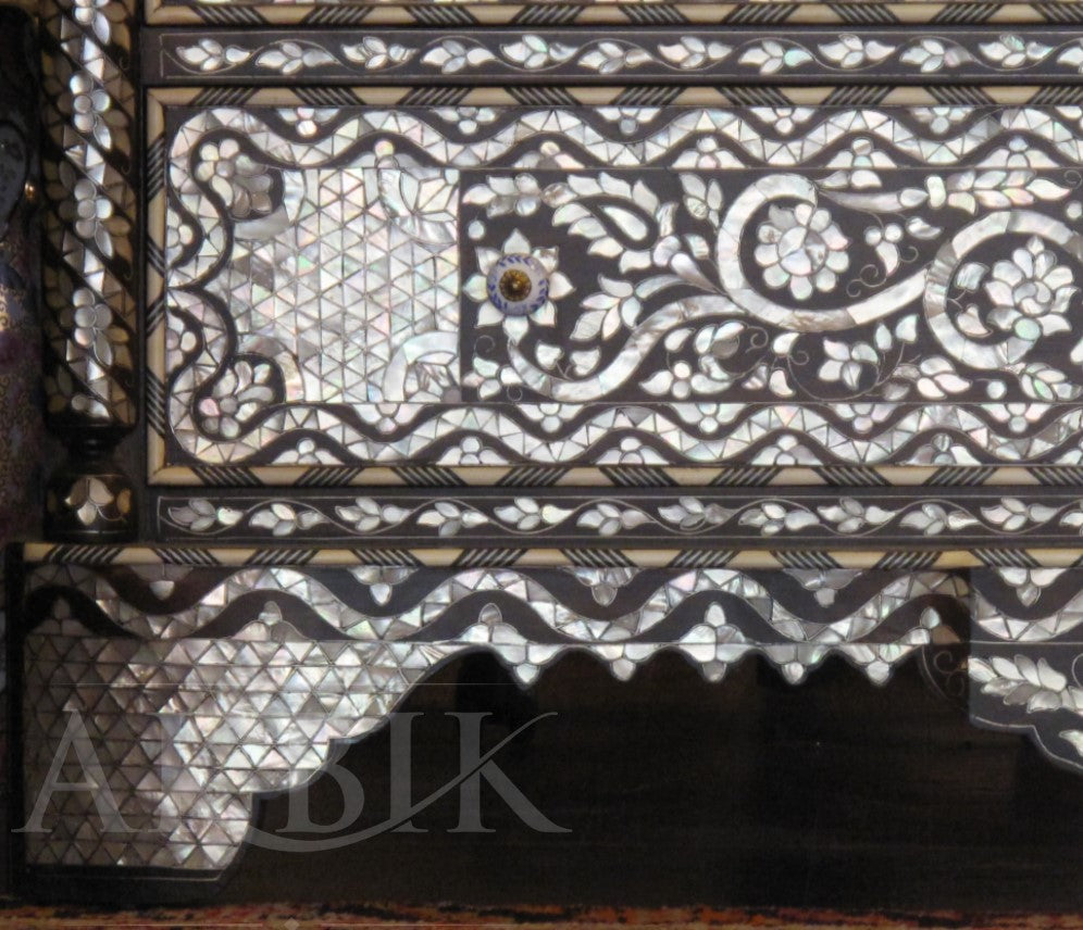 Decorative wooden box with intricate mother-of-pearl inlay, featuring geometric and floral patterns.