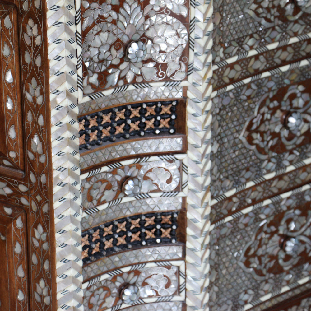 Close-up of intricately designed wooden panel with floral patterns