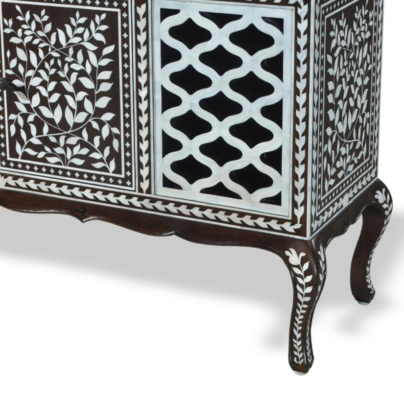 An ornate sideboard featuring mother-of-pearl inlay on a dark wood finish with intricate geometric and floral patterns.